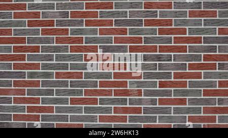 blurred brick background of red and gray blocks as a background texture for use in design, advertising and industry, defocused embossed colored bricks Stock Photo