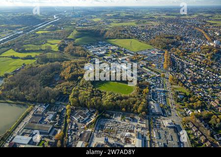 Aerial view, soccer field Hüserstraße and VW car dealership Potthoff with car parking lots, area of Radbod colliery shaft 1 and 2, surrounded by autum Stock Photo
