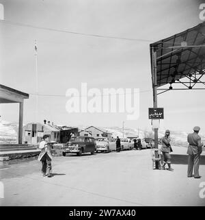 Cars and customs officers at the Syria-Lebanon border post ca. 1950-1955 Stock Photo