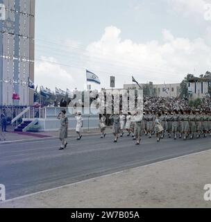 Military parade on the occasion of Independence Day (May 15). Department of women naval personnel passes the grandstand on which prominent figures, including Israeli President Ben Zvi and Prime Minister Ben Gurion, conduct the parade ca. 1964 Stock Photo