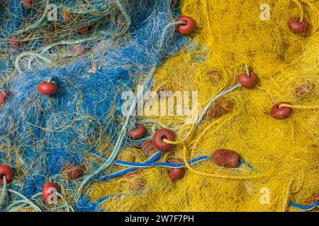 31.08.2023, Greece, Kassiopi, Korfu - Colourful fishing nets in the harbour of Kassiopi, a small harbour town in the north-east of the Greek island of Stock Photo