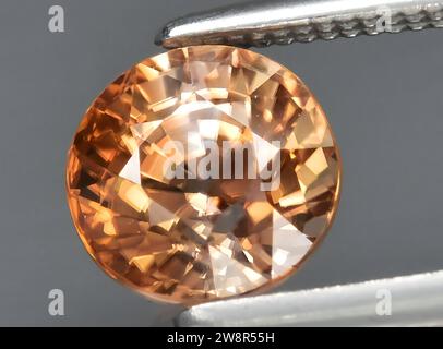 natural brown zircon gem on background Stock Photo