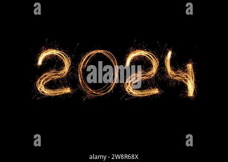 New Year 2024 Light. Sparklers Draw Figures 2024. Bengal Lights And Letter. Holidays. Luxury Stock Photo