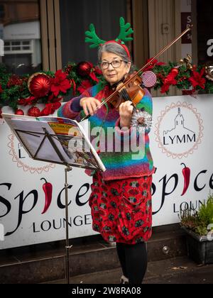 Lymm Dickensian Day 2023. People dressed in Dickensian costume; stalls in the streets; street entertainment; Grand Parade Stock Photo