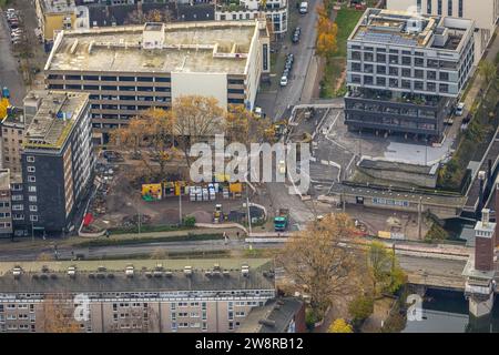 Aerial view, construction site with redevelopment of Calaisplatz next to the Schwanentorbrücke at the inner harbor, surrounded by autumnal deciduous t Stock Photo