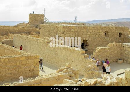 November 2022, Tourists visit the ancient ruins at Massada, built by Herod the Great, and the ancient site of Jewish revolt against the Roman occupati Stock Photo