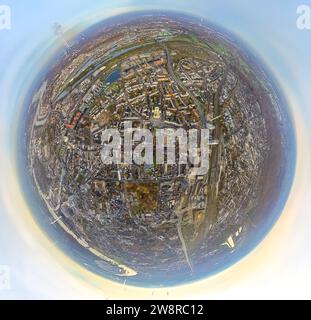 Aerial view, city center view with central station, residential area and business district, surrounded by autumnal deciduous trees, earth globe, fishe Stock Photo