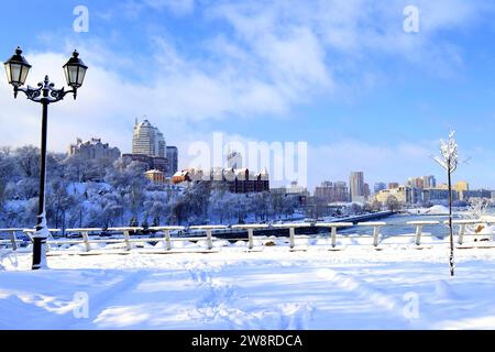 Winter city landscape, covered with snow with lantern.The best scenic view of winter street, big buildings, skyscrapers, Ukraine, Dnipro Stock Photo