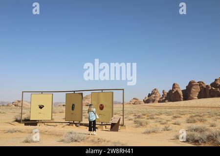 Tourist reading information boards at AlUla in Saudi Arabia Stock Photo