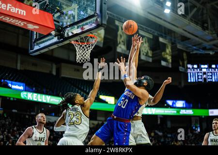 Winston-Salem, NC, USA. 21st Dec, 2023. Presbyterian Blue Hose forward Kaleb Scott (30) shoots against the Wake Forest Demon Deacons in the NCAA Basketball matchup at LJVM Coliseum in Winston-Salem, NC. (Scott Kinser/CSM). Credit: csm/Alamy Live News Stock Photo