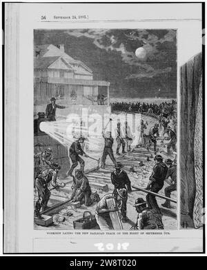 Workmen laying the new railroad track on the night of September 5th - from sketches by a staff artist. Stock Photo