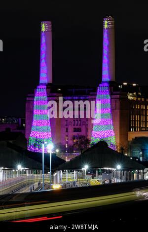 London, UK. 16th December, 2023.Battersea Power Station is lit up from dusk onwards in a festive design by artist David Hockney created on an iPad. Credit: Eleventh Hour Photography/Alamy Live News Stock Photo