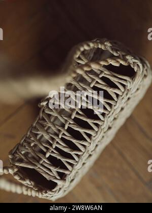 The exquisite intricacy of the woven pattern creates a captivating visual, emphasizing the natural elegance of the bag's design. The neutral beige col Stock Photo