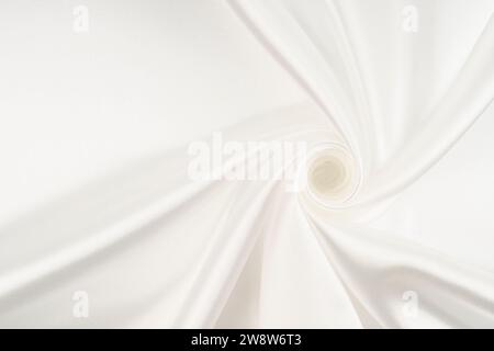 Close-up of rippled white silk fabric. Stock Photo