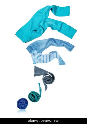 Rolled jeans unfolds and flies up, isolated on white background Stock Photo