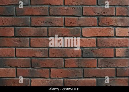 Brown brick wall made of decorative tiles for the interior Stock Photo