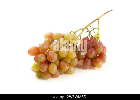 Big bunch of ripe pink grapes isolated on white background. Stock Photo