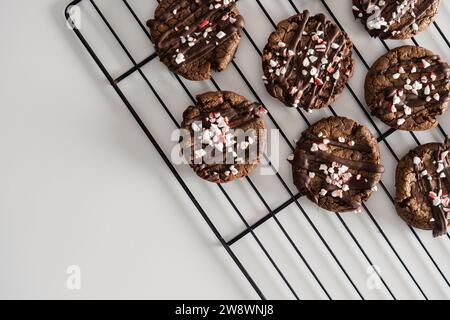 Chocolate cookies with peppermint sprinkles on baking rack. Stock Photo