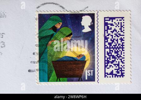 1st class Christmas stamp stuck on envelope - stamp barcoded, stamp barcode UK Stock Photo