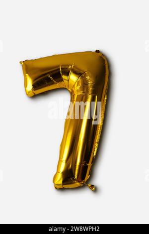 Foil balloon number seven isolated on white background. Stock Photo