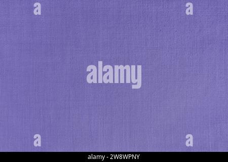 Texture background of purple linen fabric. Textile structure, cloth surface, weaving of natural cotton fabric closeup, backdrop, wallpaper. Stock Photo