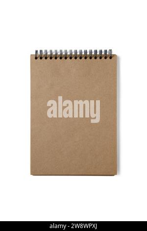 Open spiral bound notepad with craft brown sheets, isolated on white background. Top view, copy space for text, template, mockup Stock Photo