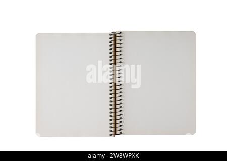 Open spiral bound notepad with empty white sheets, isolated on white background. Top view, copy space for text, template, mockup. Stock Photo