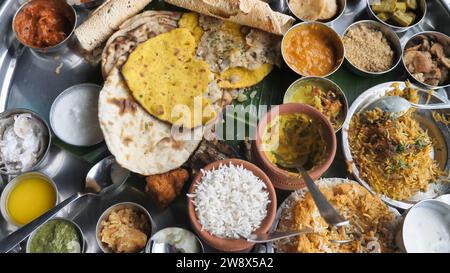 The Curry Heaven 38 Items Thali Indian Restaurant Food - Mumbai Biggest Thali - Best Indian Street Food in Mumbai, Maharashtra India - Indian cuisine. Stock Photo