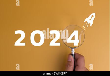 New Year 2024 business planning and strategy concept. Business start up target, marketing financial and research analysis, investment Magnifying glass Stock Photo