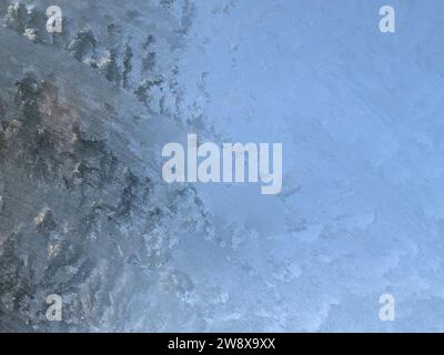 Texture on Ice sheet forming an abstract figure of whites and grays. Stock Photo
