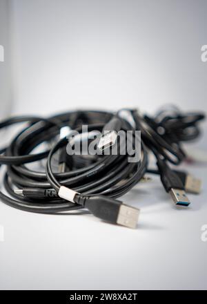 Usb cables tangled together in a messy pile Stock Photo