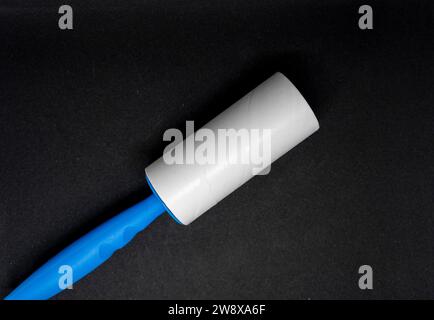 Sticky roller lint remover for clothes Stock Photo