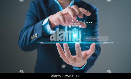 Businessman uses tablet to type chat Ask and answer with the artificial intelligence system, chatbot, AI assistant. Stock Photo