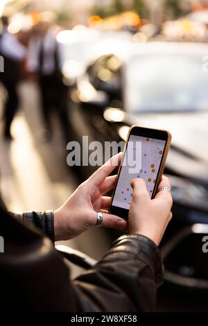 Woman operating map through smart phone in city Stock Photo