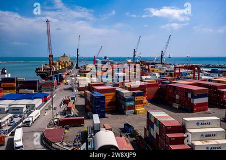 View of the container harbour in Salerno with containers, cranes and trucks. Stock Photo