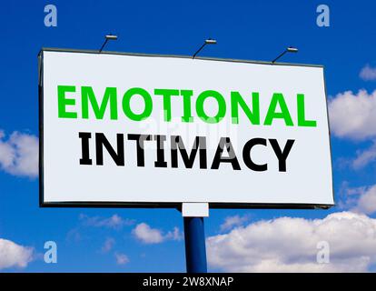 Emotional intimacy symbol. Concept words Emotional intimacy on beautiful white billboard. Beautiful blue sky white cloud background. Psychology emotio Stock Photo