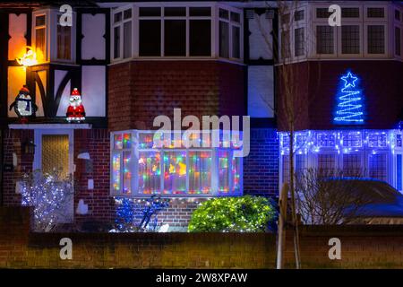 Lower Morden, Surrey, London, UK. 22nd Dec, 2023. Many residents of Lower Morden Lane decorate the exterior of their homes each Christmas. Visitors to the street donate to the collecting boxes locally and the money is given to a good local cause - St Raphael’s Hospice. Credit: Malcolm Park/Alamy Live News Stock Photo