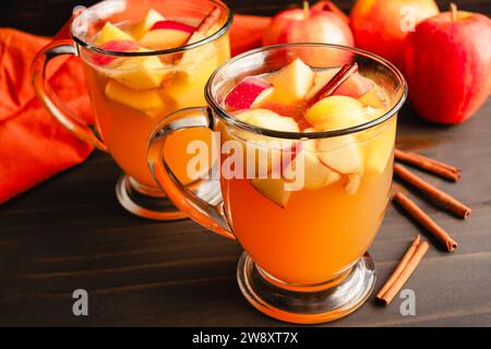 Fall Sangria Made with White Wine, Apples, Pears, and Cinnamon: Autumn sangria flavored with chunks of fruit, bourbon whiskey, and maple syrup Stock Photo