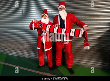 December 22, 2023: Santa Claus passes out gifts during NCAA basketball