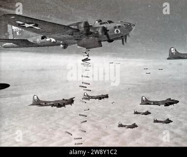 BOEING B-17 FLYING FORTRESSES of the USAF bombing through cloud  over Germany on a signal from the formation leader who used radar to find the target, Stock Photo