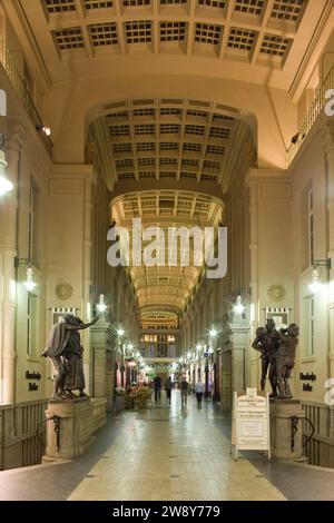 In the Maedler Passage, the entrance to Auerbachs Keller, passers-by are greeted by Goethe's Faust and Mephisto. The wall and ceiling paintings by Stock Photo