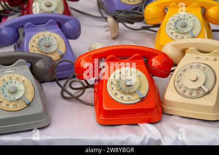 Italy, Lombardy, Old Colored Plastic Analog Phone in a Flea Market Stock Photo