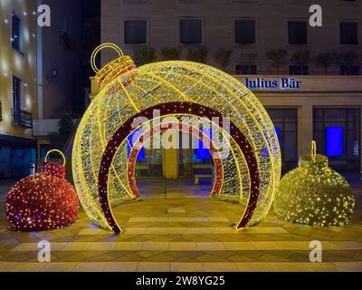 Lugano, Switzerland - December 2, 2023: A large illuminated Christmas balloon in front of the Julius Bar bank in Lugano Stock Photo