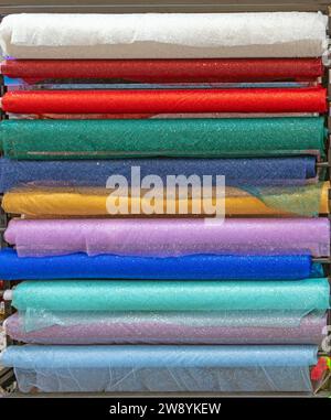 Colorful shimmer fashion materials pattern background sold on a market Stock Photo