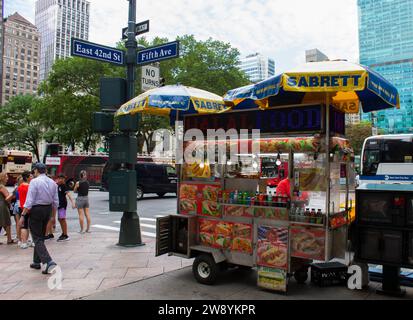 East 42nd St and Fifth Ave, New York City, NY, USA - July 3 2023: Food truck on the street in New York City Stock Photo