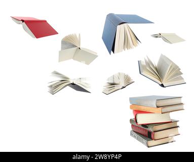 Books flying over stack on white background Stock Photo
