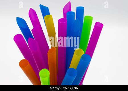 A bunch of multicolored jumbo plastic straws for smoothies, shakes and bubble tea Stock Photo