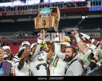 December 22, 2023: Georgia Tech players hoist the Trophy after the Union Home Mortgage Gasparilla Bowl. Georgia Tech defeated UCF 30-17 at Raymond James Stadium in Tampa, FL. Romeo T Guzman/Cal Sport Media Stock Photo