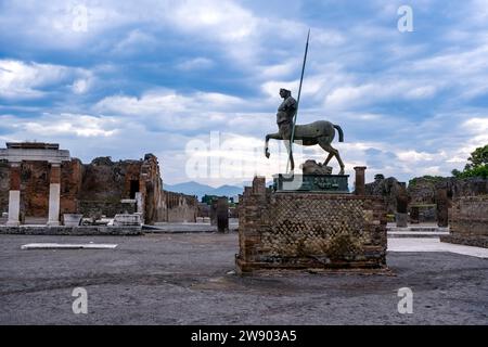 Ruins of the Forum and Centaur Statue, Statua di centauro in the archaeological site of Pompeii, an ancient city destroyed by the eruption of Mount Ve Stock Photo