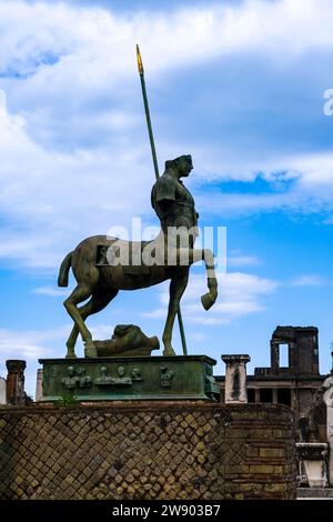 Ruins of the Forum and Centaur Statue, Statua di centauro in the archaeological site of Pompeii, an ancient city destroyed by the eruption of Mount Ve Stock Photo